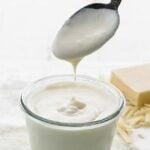 pouring mornay into a jar