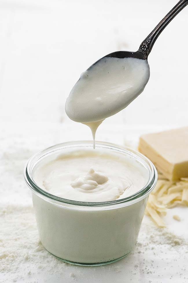 pouring mornay into a jar