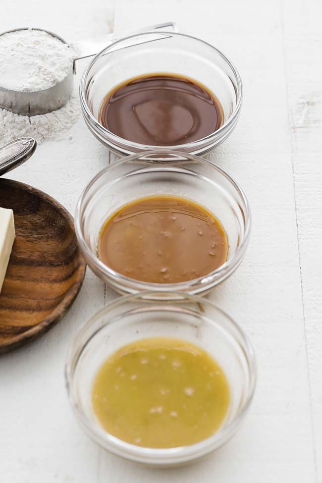 three different stages of roux in bowls when making this recipe 