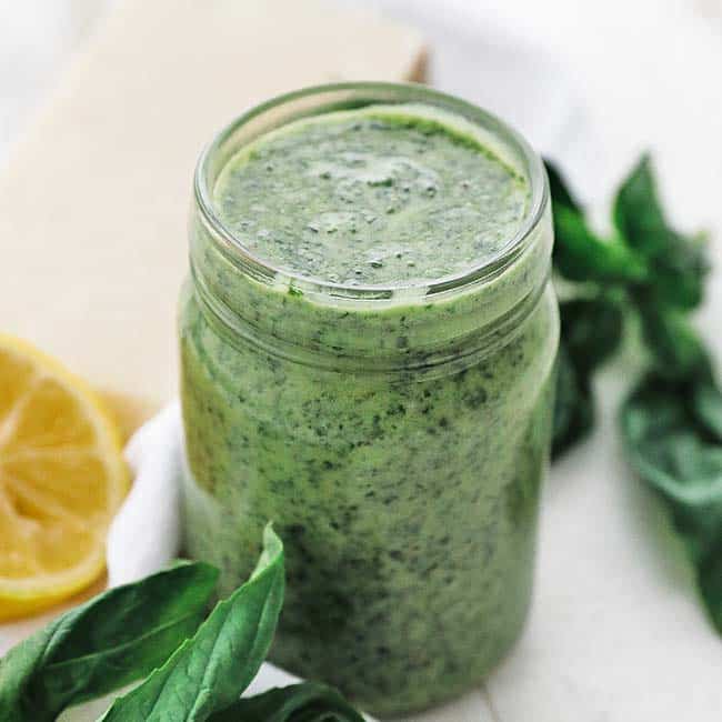 jar full of creamy homemade basil pesto