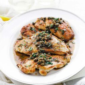 platter of chicken piccata with capers