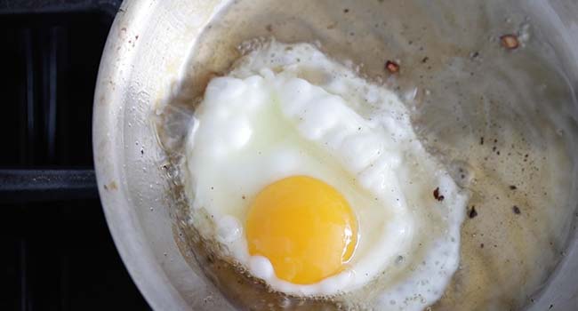 fried egg in a oil in a pan