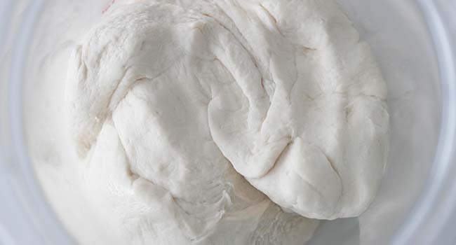 rising dough in a container