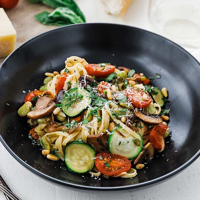 bowl of pasta with fresh vegetables