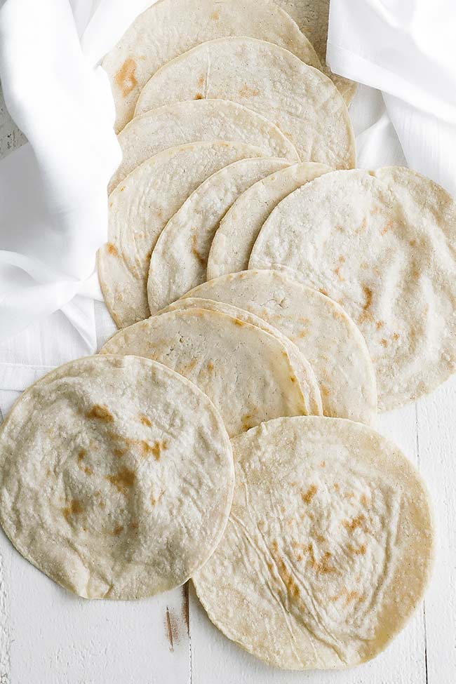 cooked corn tortillas on a towel