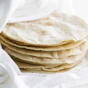 stacked corn tortillas in a towel