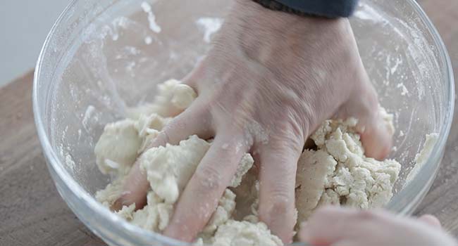 kneading corn tortillas