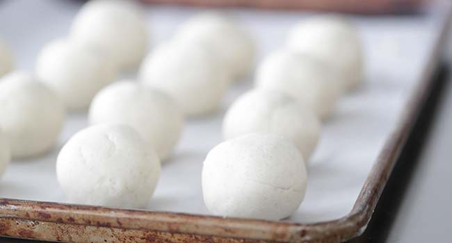 corn tortilla balls on a sheet tray