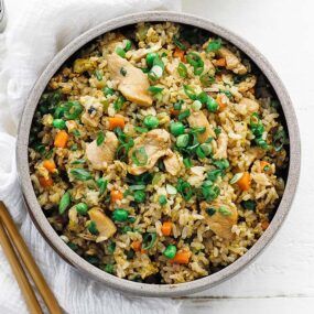 bowl of chicken fried rice with green onions