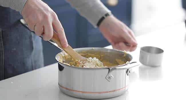 mixing cheese into dough