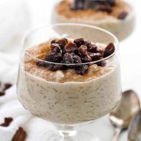 glass jar of cinnamon rice pudding with raisins