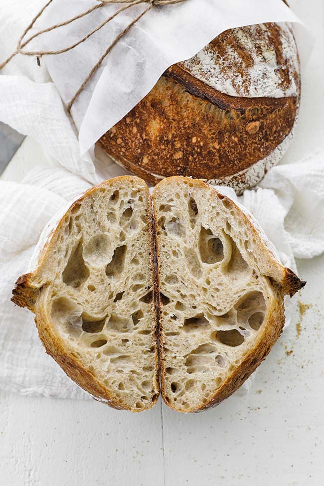 sliced cooked sourdough bread and a whole loaf