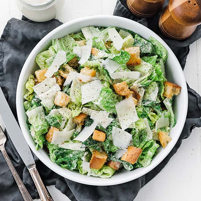 bowl of caesar salad with croutons