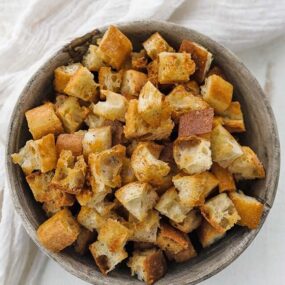 a bowl of browned bread croutons