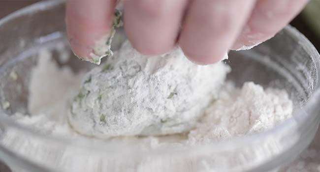 rolling gnudi balls in some flour