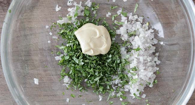 mustard, chopped basil and shallots in a bowl