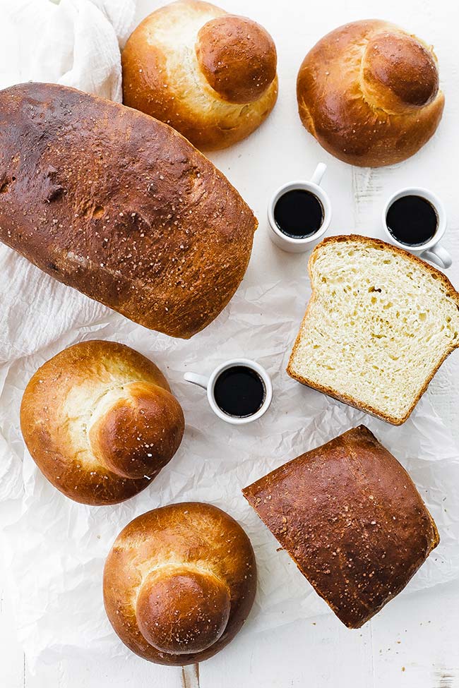 loaved of brioche and brioche buns served with espresso 