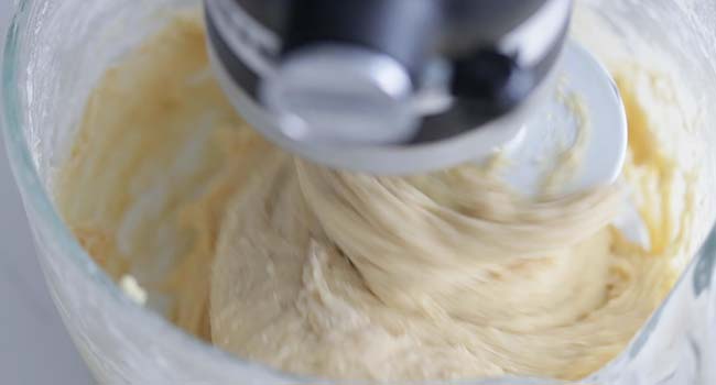 brioche bread dough mixing in a stand mixer