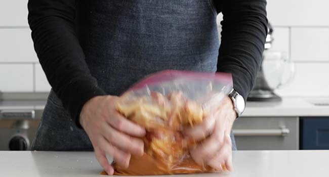 moving marinated bulgogi around in a plastic bag