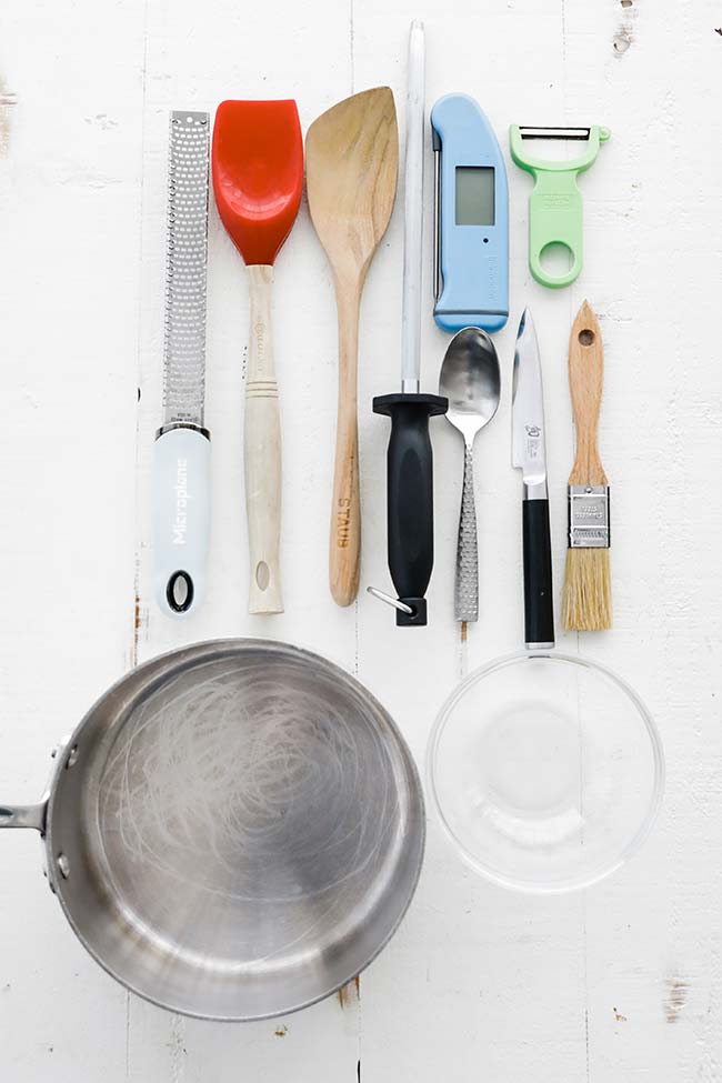table with different kitchen tool essentials