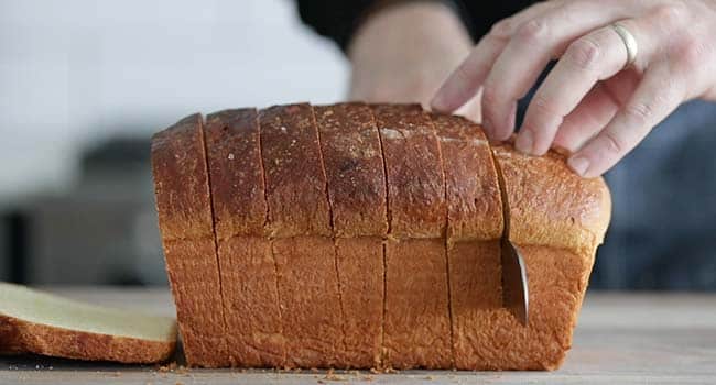 slicing brioche bread for french toast
