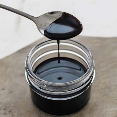 jar of reduced balsamic with a spoon