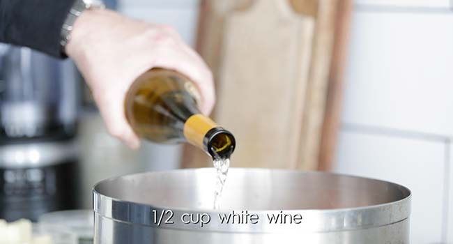 deglazing with white wine in a pot