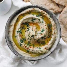 bowl of baba ganoush with olive oil and parsley