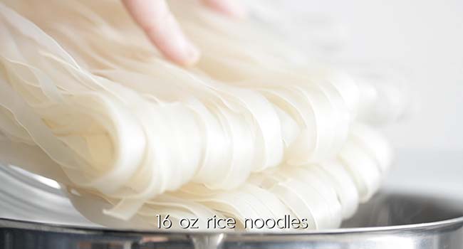 cooking rice noodles in a pot