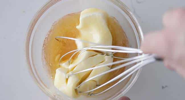 whisking butter with honey