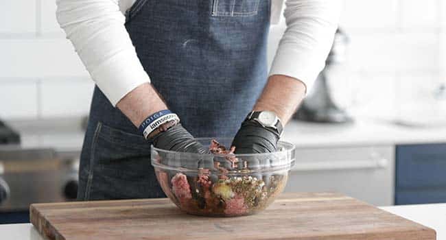 mixing together beef kofta recipe in a bowl