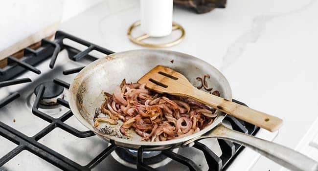caramelizing onions in a pan