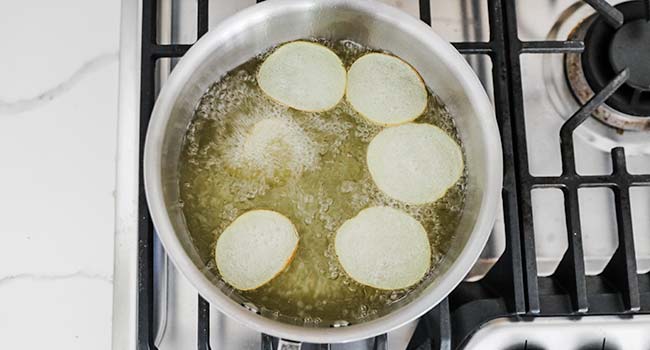 frying potato chips in oil