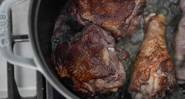 red wine cooked chicken in a pot