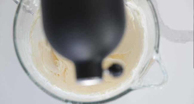 whipping butter and cream cheese in a stand mixer