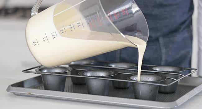 adding batter to popover pans