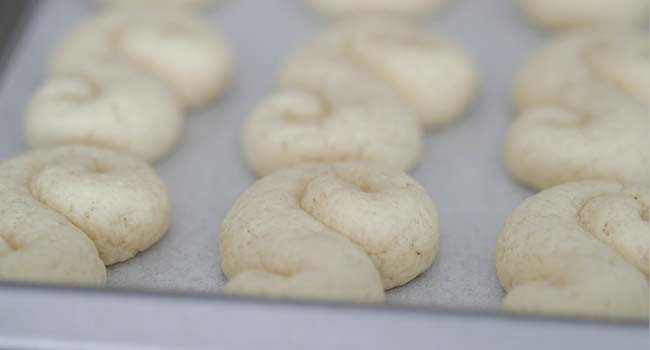 baked s cookies on a sheet tray with parchment paper
