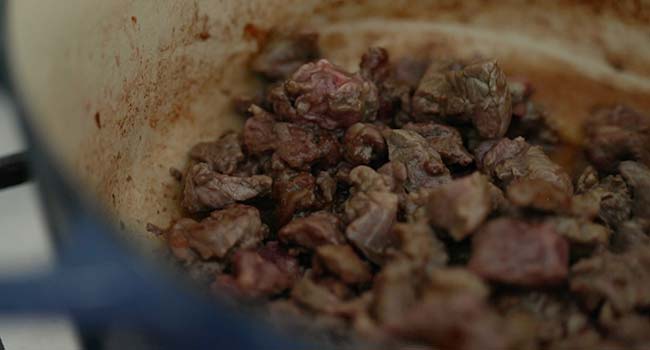 browning cubed beef in a large pot