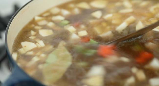 beef and barley soup in a pot