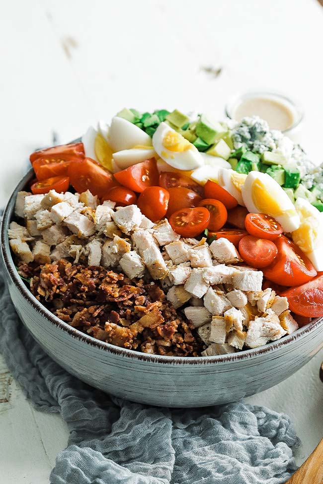 large cobb salad with bacon in a bowl