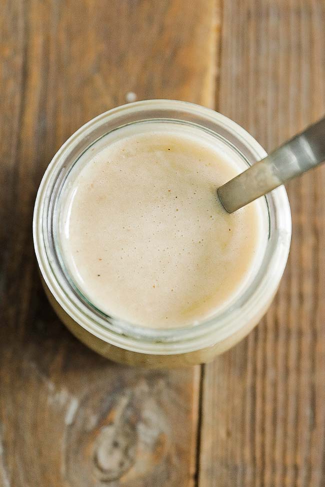 jar of mustard vinaigrette with a spoon