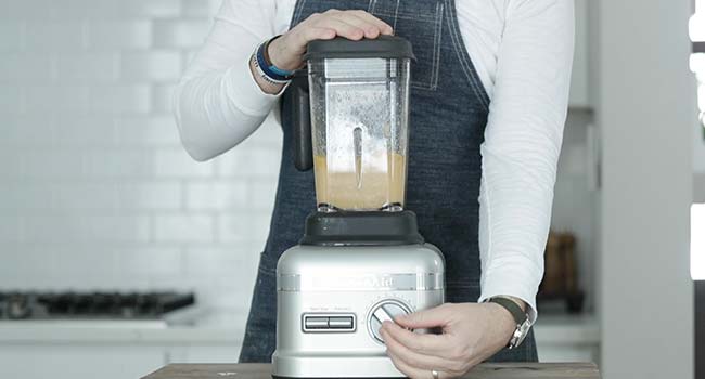 blending a salad dressing in a blender