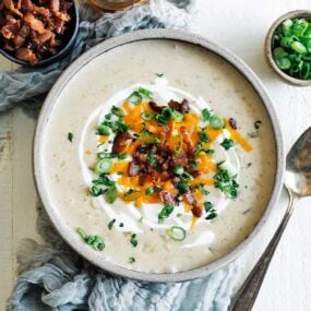 bowl of potato soup with toppings