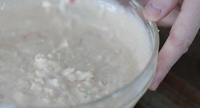 whisking together a bowl of thousand island dressing