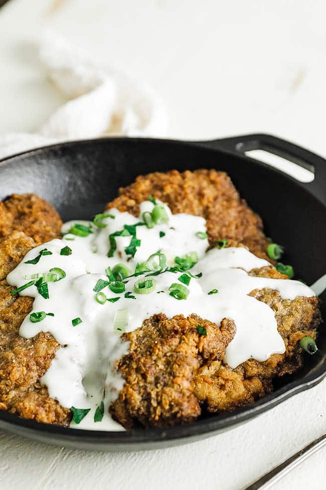 fried steak with breading and gravy