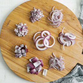 cutting board with different onion cuts