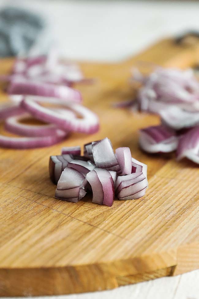 large diced onion on a cutting board