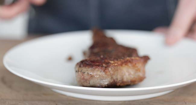 resting a cooked steak on a plate