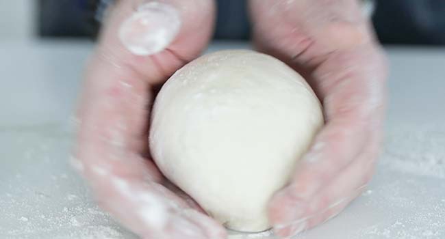 forming a pizza dough ball
