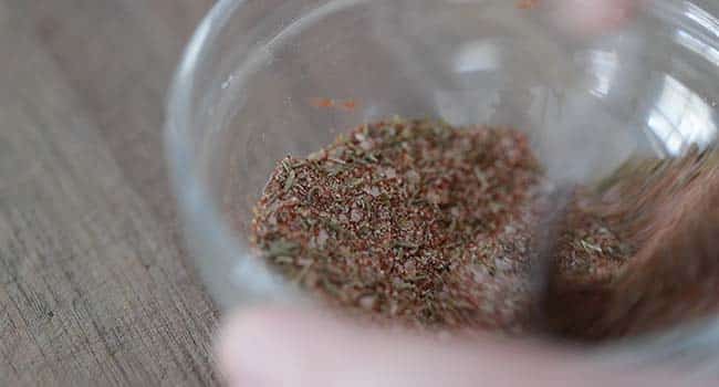 mixing together spices in a bowl